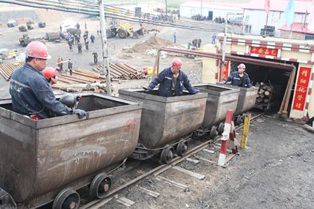 Miners prepare to enter the Jaiyi coal mine in Jixi, Heilongjiang, where six people were trapped because of flooding. Photo: Xinhua