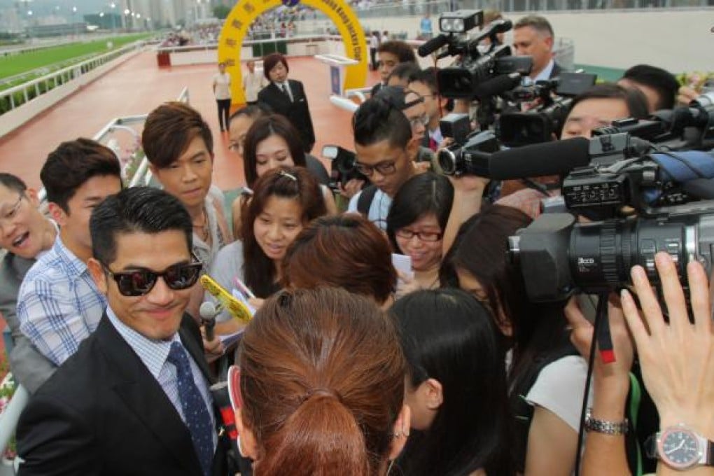 Happy owner Aaron Kwok couldn’t escape the media frenzy at Sha Tin on Sunday. Photo: Kenneth Chan