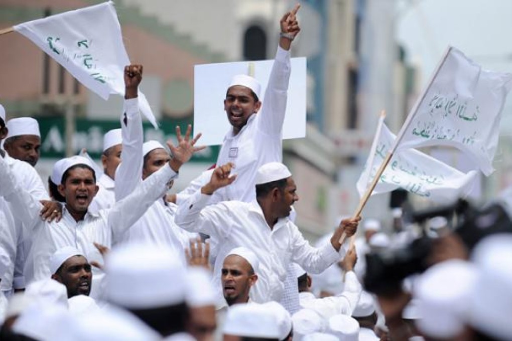 Sri Lankan Muslims take part in a protest against an anti-Islam film made in the US, in Colombo on Monday. Photo: AFP