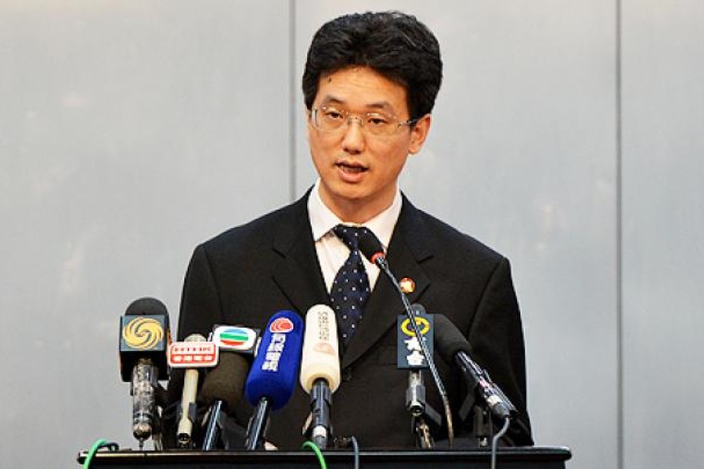 Chengdu People's Intermediate court spokesman Yang Yuquan delivers the verdict of Wang Lijun on Monday. Photo: AFP