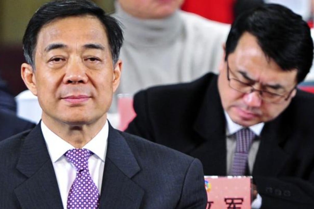 Then Chongqing Communist Party Secretary Bo Xilai (L) and Deputy Mayor Wang Lijun attend a meeting in Chongqing municipality in this January 7, 2012 file photo. Photo: REUTERS