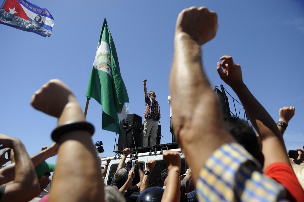 Marinaleda Mayor Juan Manuel Sanchez Gordillo (centre) denounces the Spanish government's handling of the economic crisis on a demonstration march last month. Photo: AFP