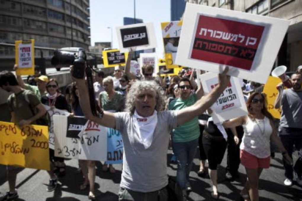 Employees of the Israeli newspaper Maariv demonstrate against their dismissals in Tel Aviv. The iconic Israeli newspaper is on the verge of collapse. Photo: EPA