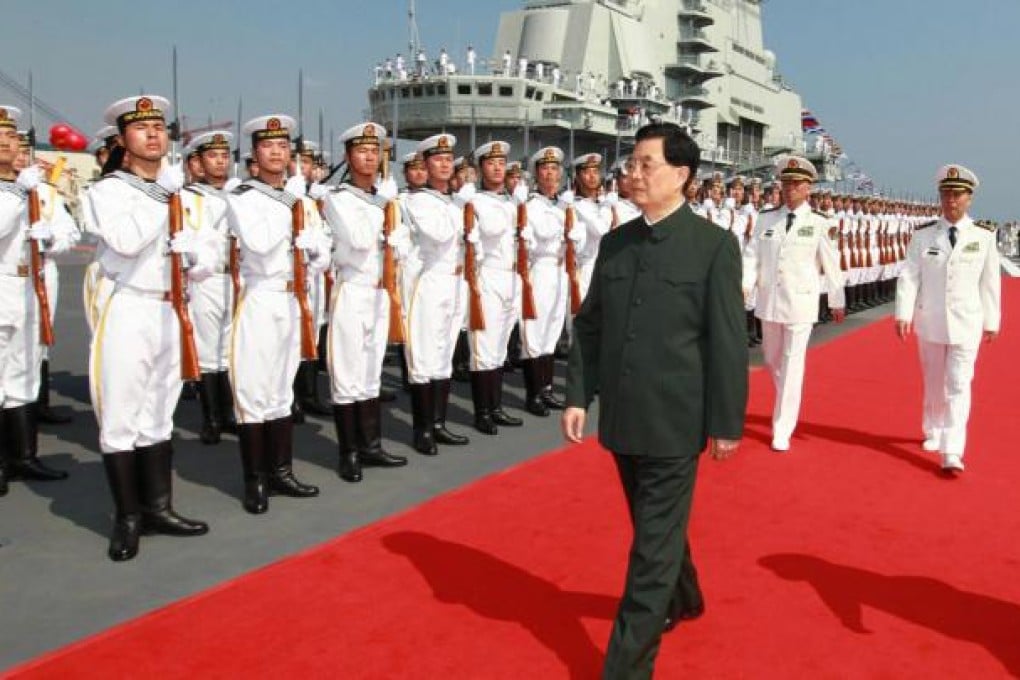 President Hu Jintao inspects the honour guard at the ceremony in Dalian. Photo: Xinhua