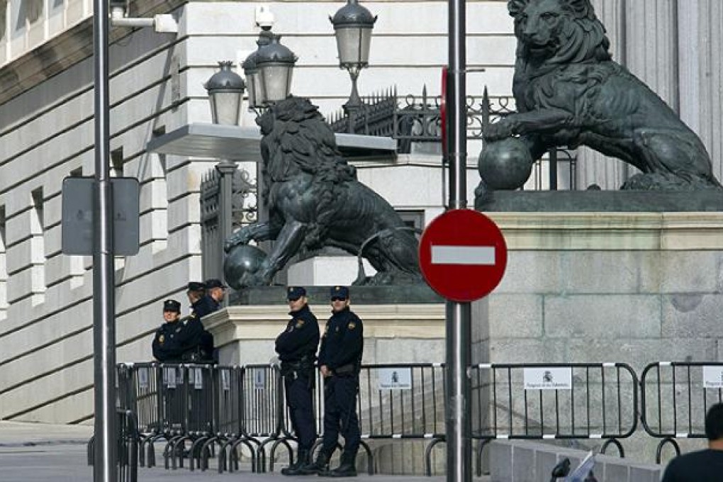 Police guard the entrance of the Spanish parliament in Madrid. Photo: AP