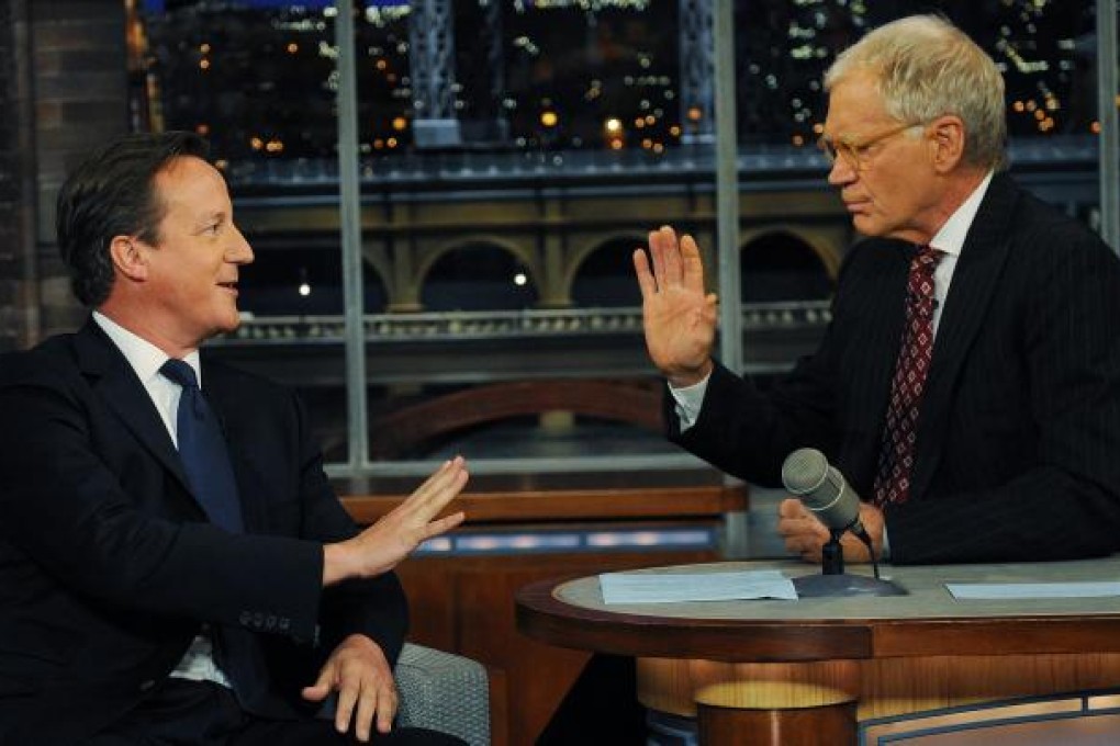 British Prime Minister David Cameron talks with American chat-show host David Letterman after addressing the UN General Assembly in New York on Wednesday. Photo: AP