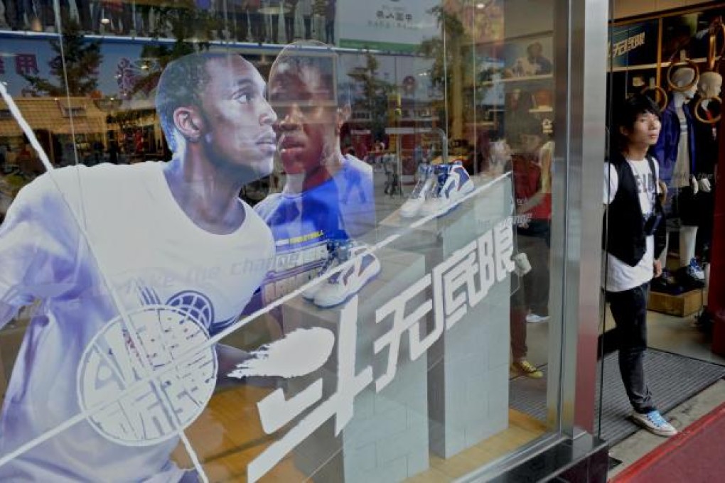 Customers visit a Li Ning store in Beijing. Photo: Bloomberg