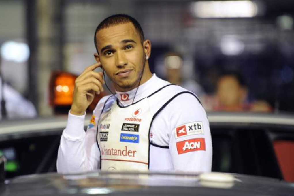 British Formula One driver Lewis Hamilton as he prepares on the starting grid of the Formula One Singapore Grand Prix race in Singapore on Sunday. Photo: EPA