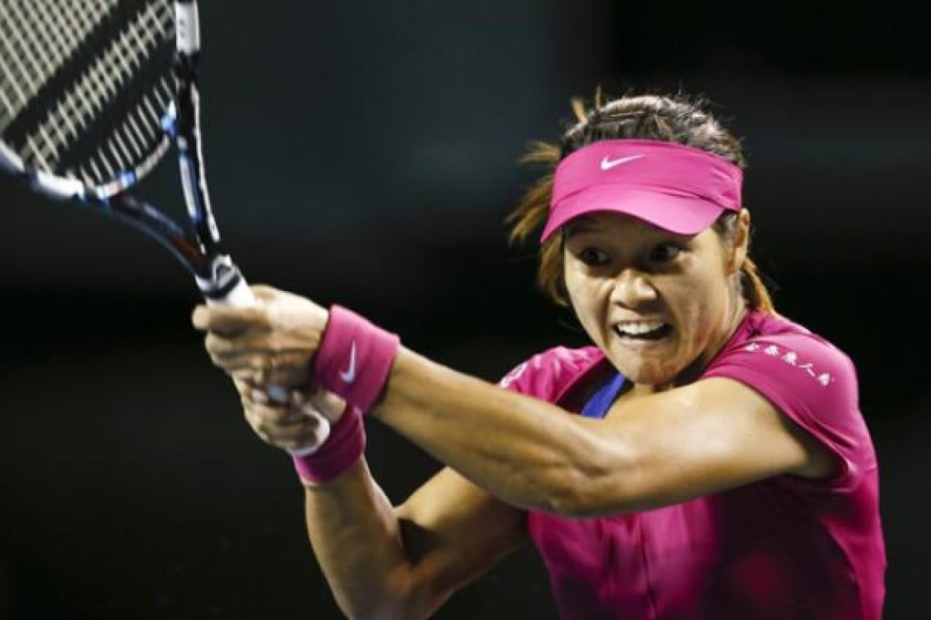 Li Na of China returns to Caroline Wozniacki of Denmark during the third round match for the Pan Pacific Open tennis tournament in Tokyo on Wednesday. Photo: EPA