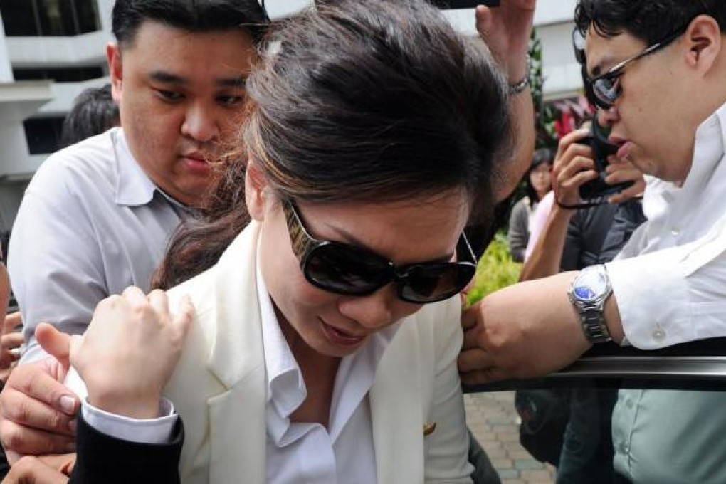 Cecilia Sue leaves court after the hearing yesterday. Photo: AFP