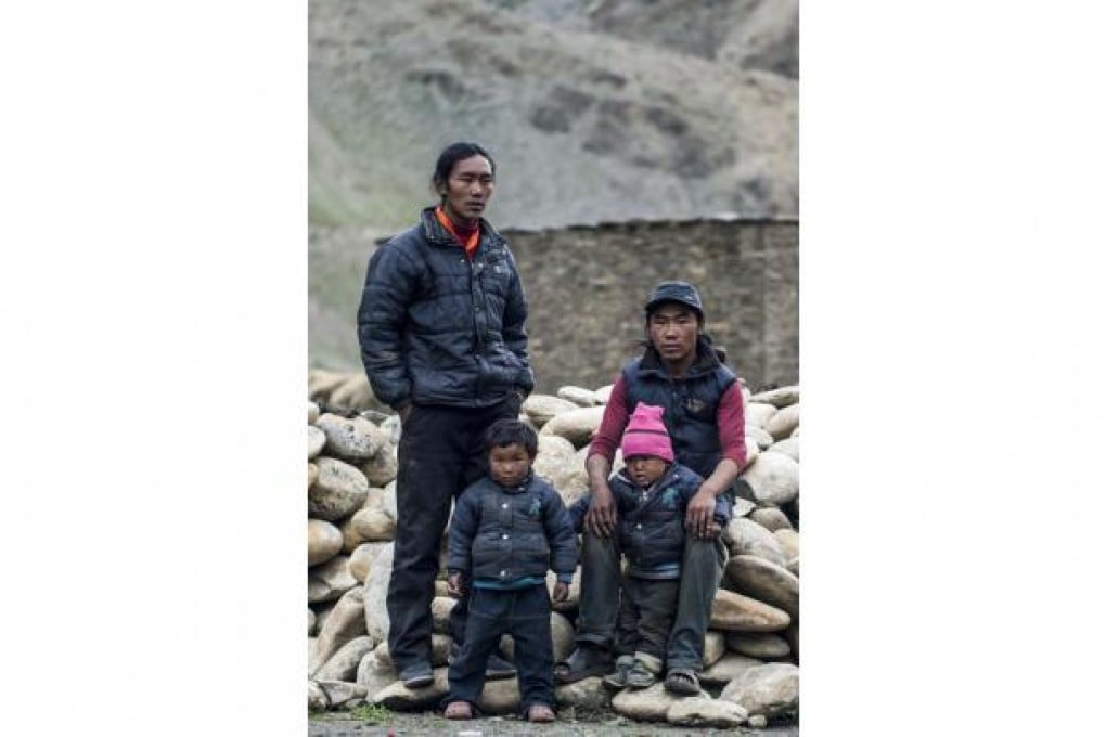 Brothers Pasang (left) and Mingmar Lama share a wife in a polyandrous marriage, and now have children. Photo: AFP