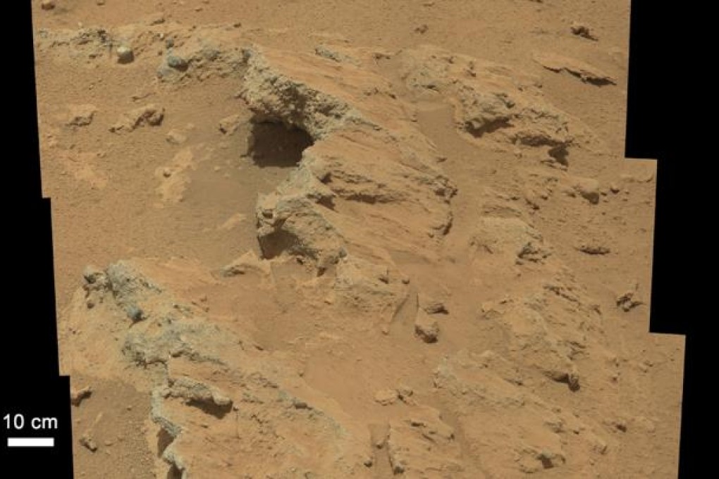 This image released by Nasa shows pebbles cemented into layers of conglomerate rock at a site between the north rim of the Gale Crater and the base of Mount Sharp. Photo: AFP