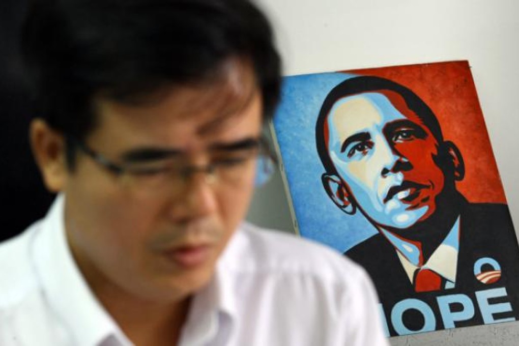 Le Quoc Quan, one of Vietnam's better-known dissidents and a leading blogger, works at his office in Hanoi on Friday. Photo: AP