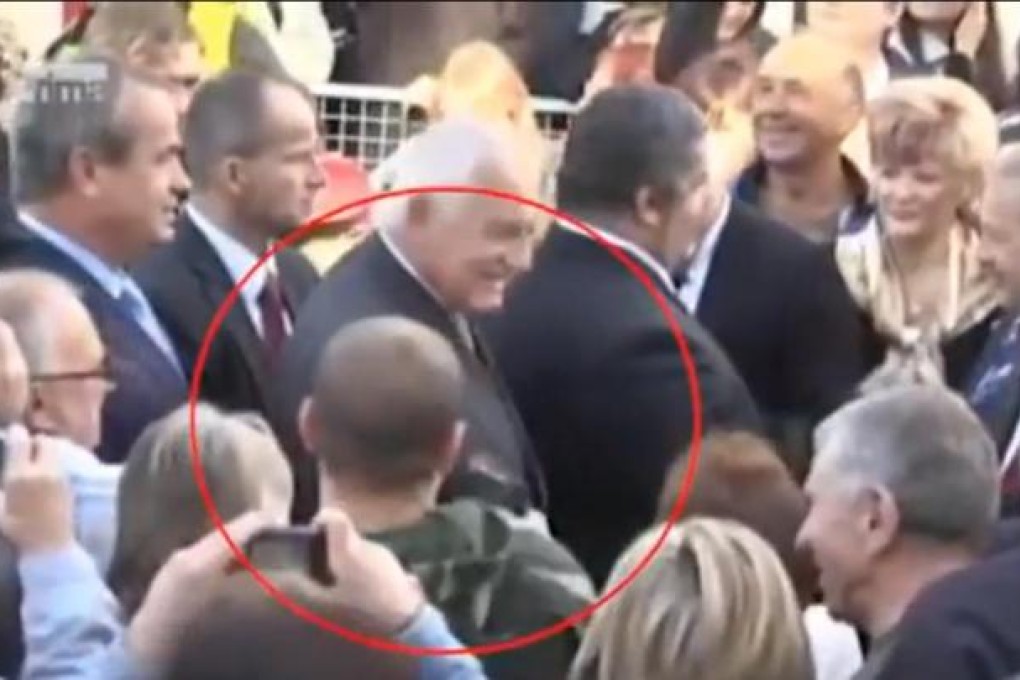 Pavel Vondrous (circled) about to attack President Vaclav Klaus