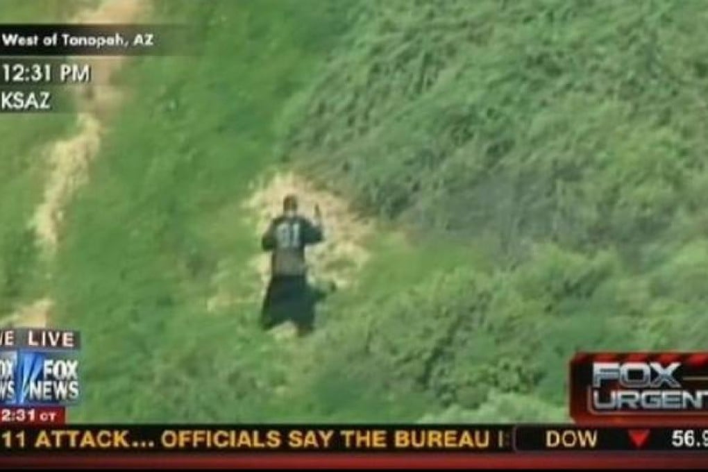 The suspect prepares to shoot himself on the live TV footage.