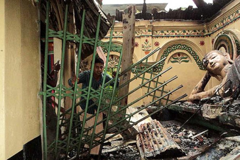 A Buddhist temple at Ramu is destroyed by fire. Photo: AFP
