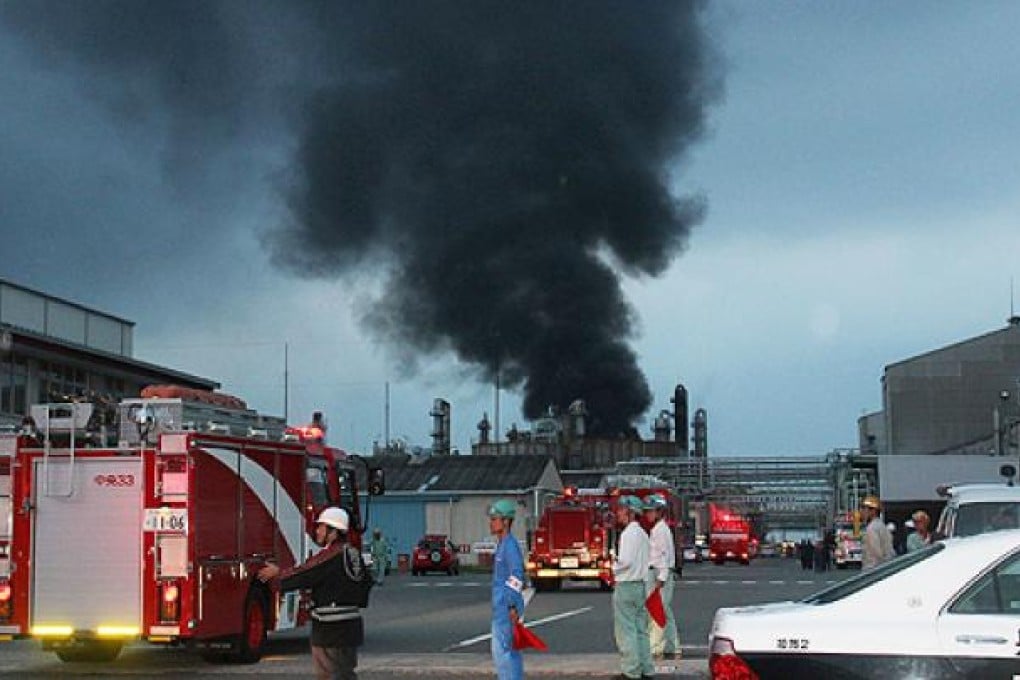 Smoke rises from a chemical plant in Himeji city, Hyogo prefecture, as firefighters arrive at the scene on Saturday. Photo: AFP