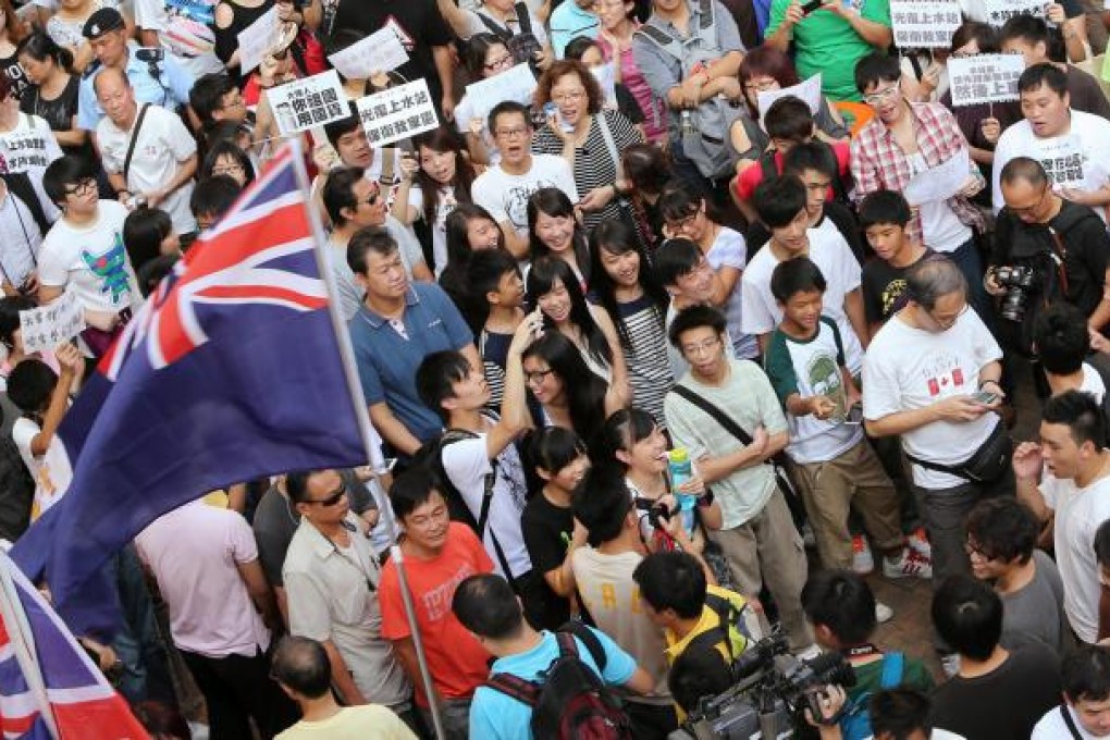 Colonial-era flags on view at a protest in Sheung Shui.