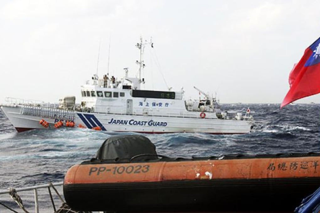 A Japanese coastguard vessel approaches a Taiwanese boat last week in waters near the dispute Diaoyu islands. Photo: EPA