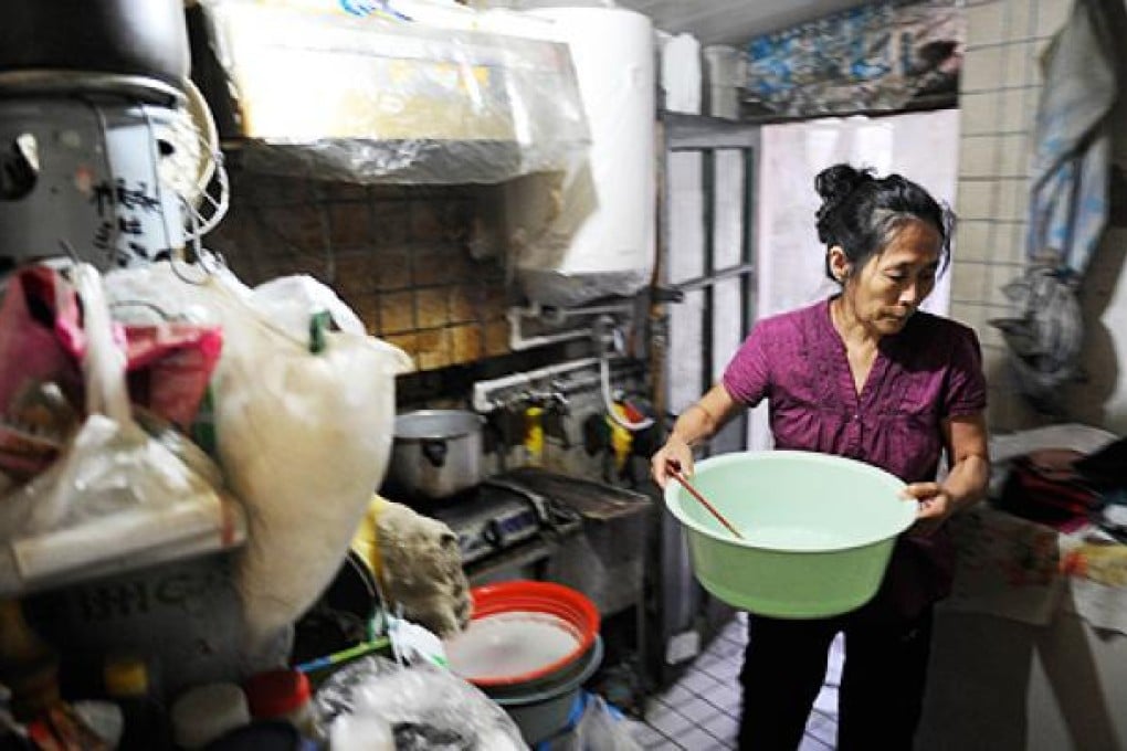 Wu Rui does housework in her home in Beijing. She lost her only daughter one year later after a long struggle with epilepsy. Photo: AFP