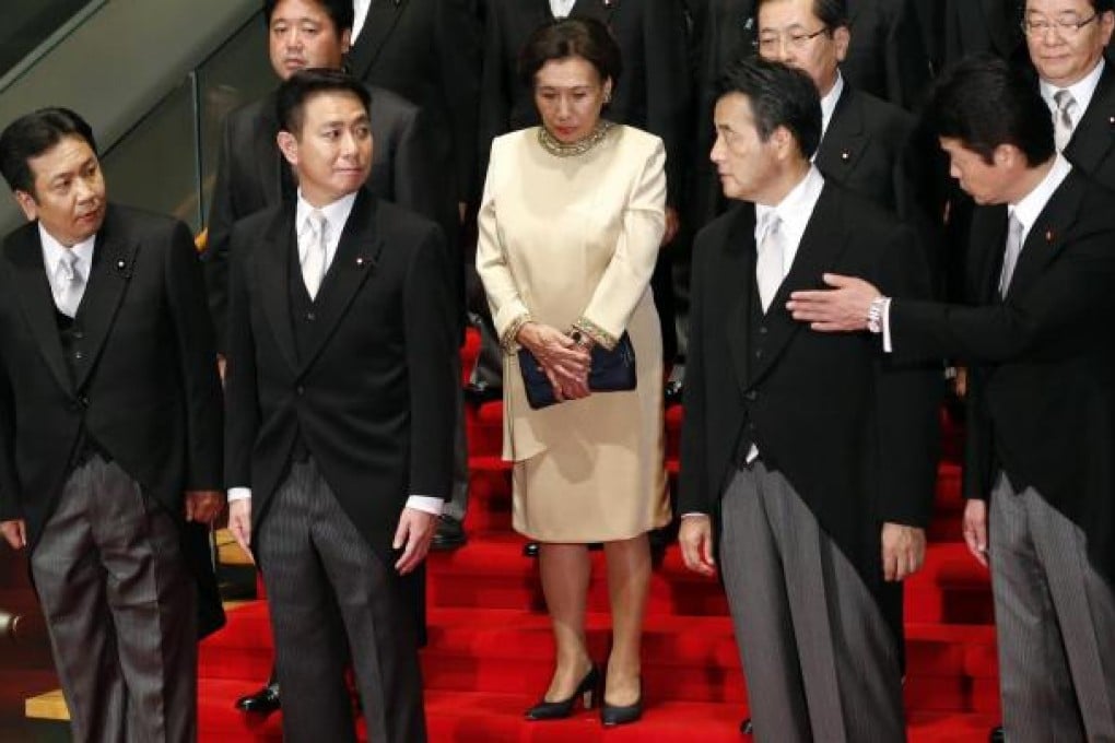 New education minister Makiko Tanaka (centre) poses with other cabinet members after their meeting yesterday. Photo: Reuters
