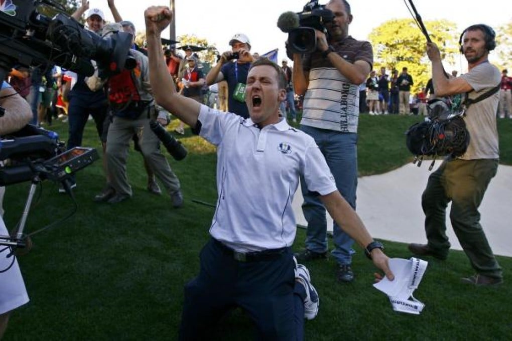 Englishman Ian Poulter celebrates after winning his singles match against Webb Simpson. Photo: Reuters