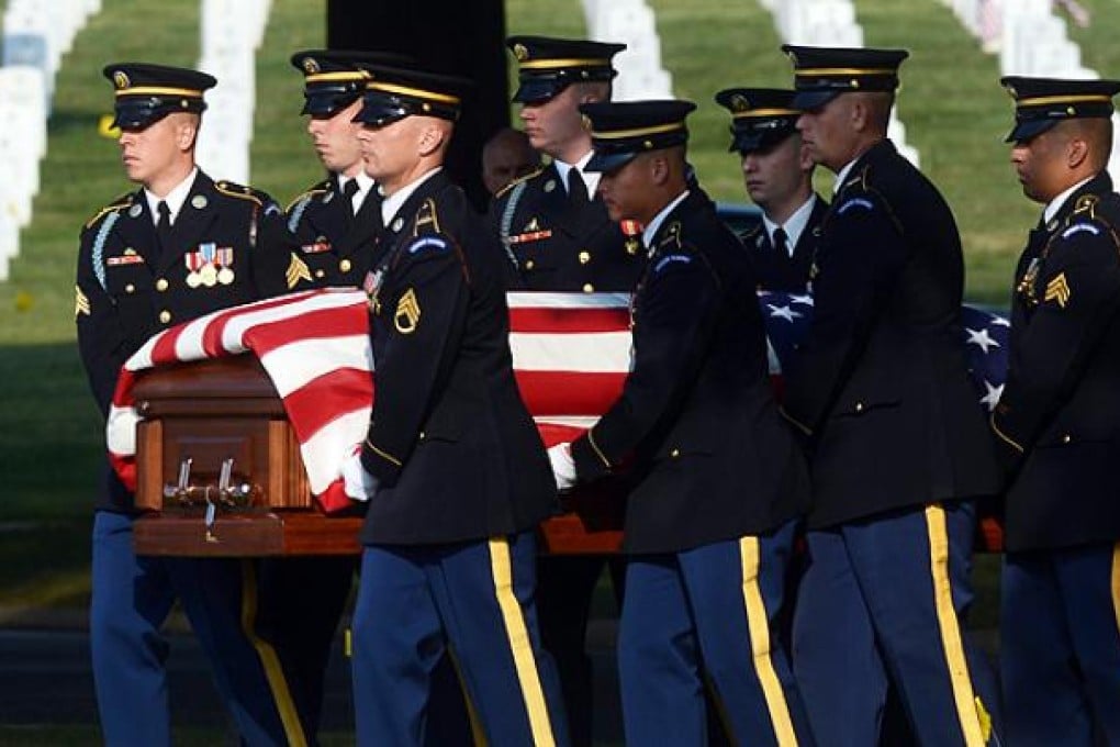 A burial service at Arlington cemetery, Virginia, for US Army Chief Warrant Officer Thalia Ramirez who was killed on duty in Afghanistan. Photo: EPA