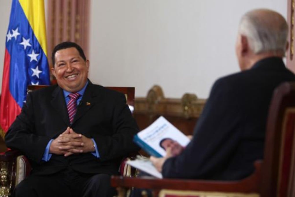 Venezuelan President Hugo Chavez (left) is interviewed by journalist Jose Vicente Rangel for a local television show in Caracas on September 30. Photo: Xinhua