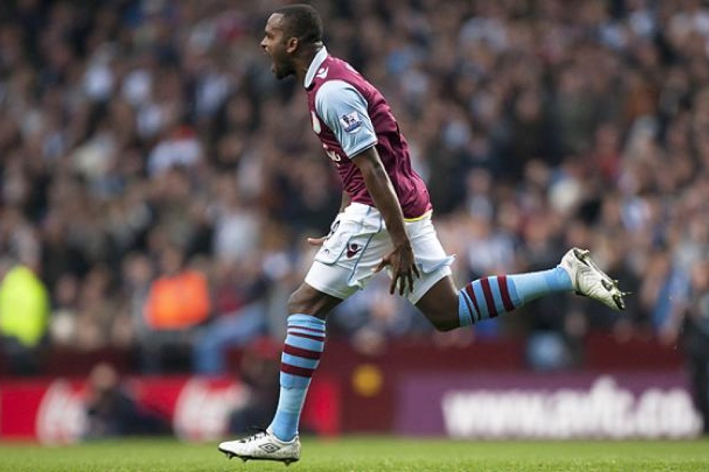 Darren Bent scores against West Bromwich at Villa Park Stadium. Photo: AP