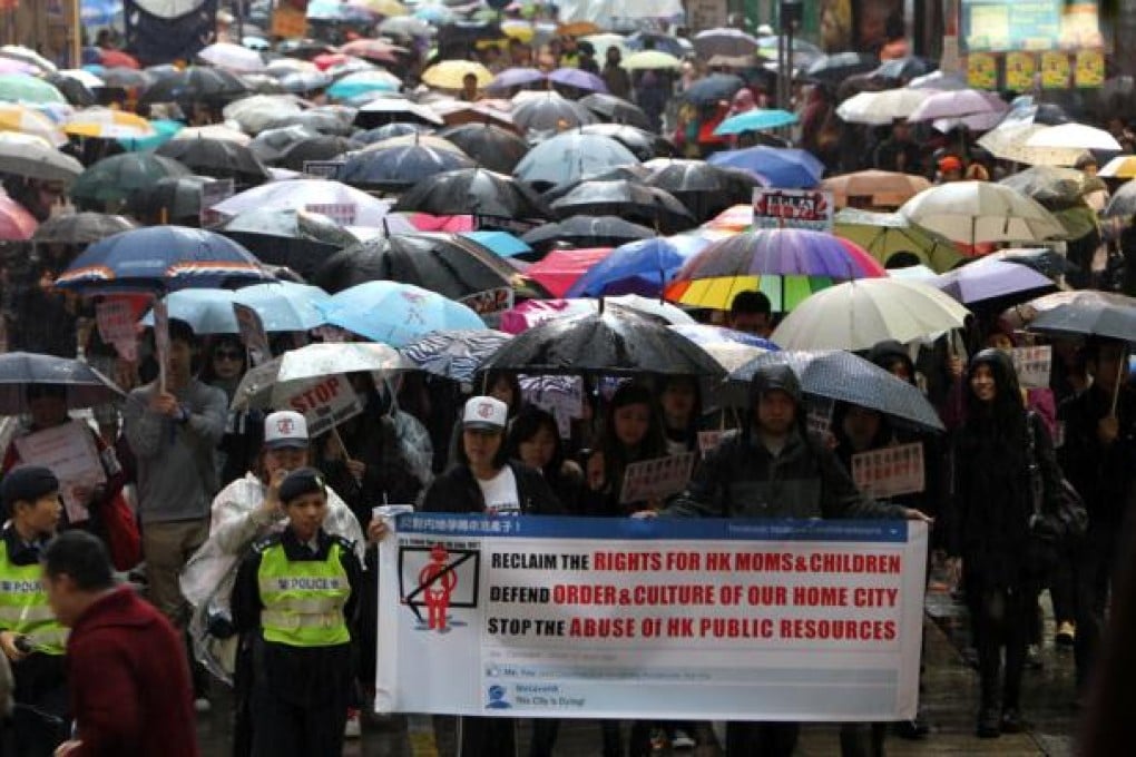 Protest against mainland mothers giving birth in Hong Kong. They march from Victoria Park to Central Government Offices in Tamar. Photo: Dickson Lee