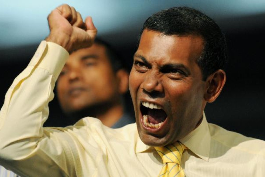 Mohamed Nasheed was seen leaving on a boat. Photo: AFP
