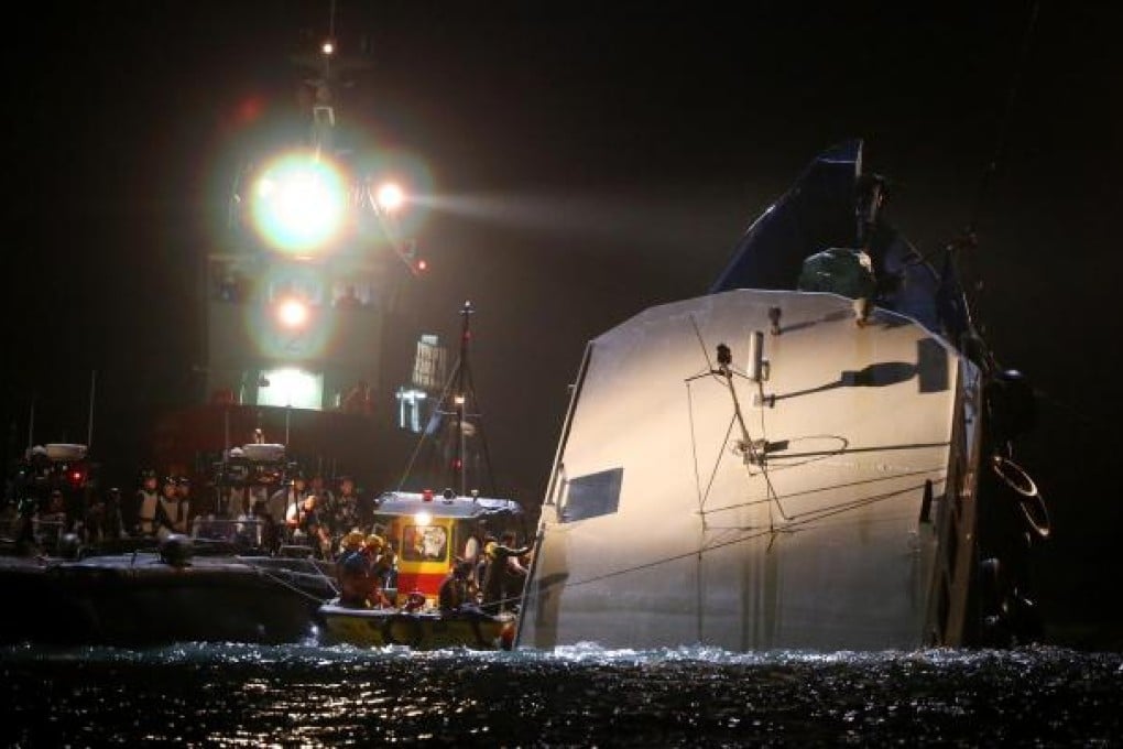 Rescuers beside Lamma IV after it collided with Sea Smooth. Photo: Sam Tsang