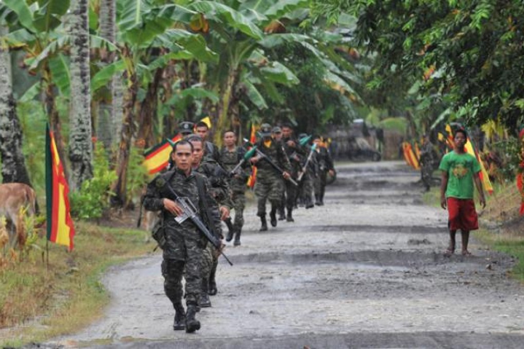 Moro Islamic Liberation Front (MILF) rebels patrolling in Sultan Kudarat province, on the southern Philippine island of Mindanao. Photo: AFP