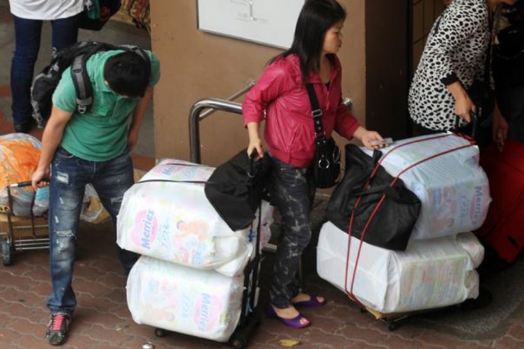 Parallel-import traders are seen operating around Sheung Shui MTR station. Photo: Nora Tam