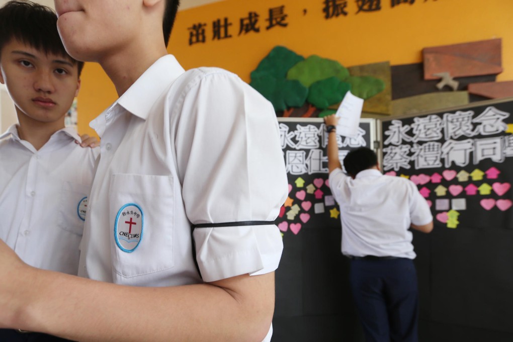 Students at CNEC Lai Wing Sang Secondary School mourn the loss of two fellow pupils. Photo: Sam Tsang