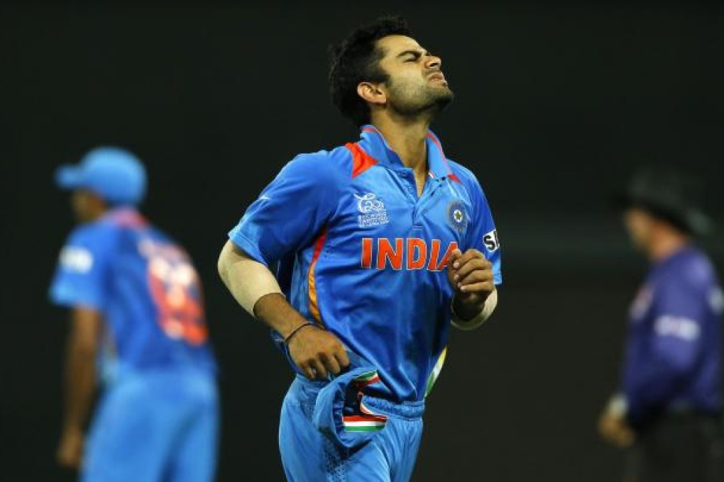 India's Virat Kohli reacts as his team fail to reach the semi-finals during their Twenty20 Cricket World match with South Africa. Photo: AP