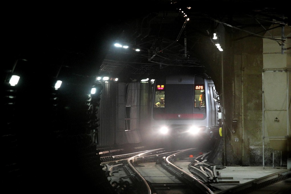 MTR staff repair a ventilation duct that came loose and disrupted morning rail services for two hours yesterday between Admiralty and Sheung Wan. Photo: Dickson Lee