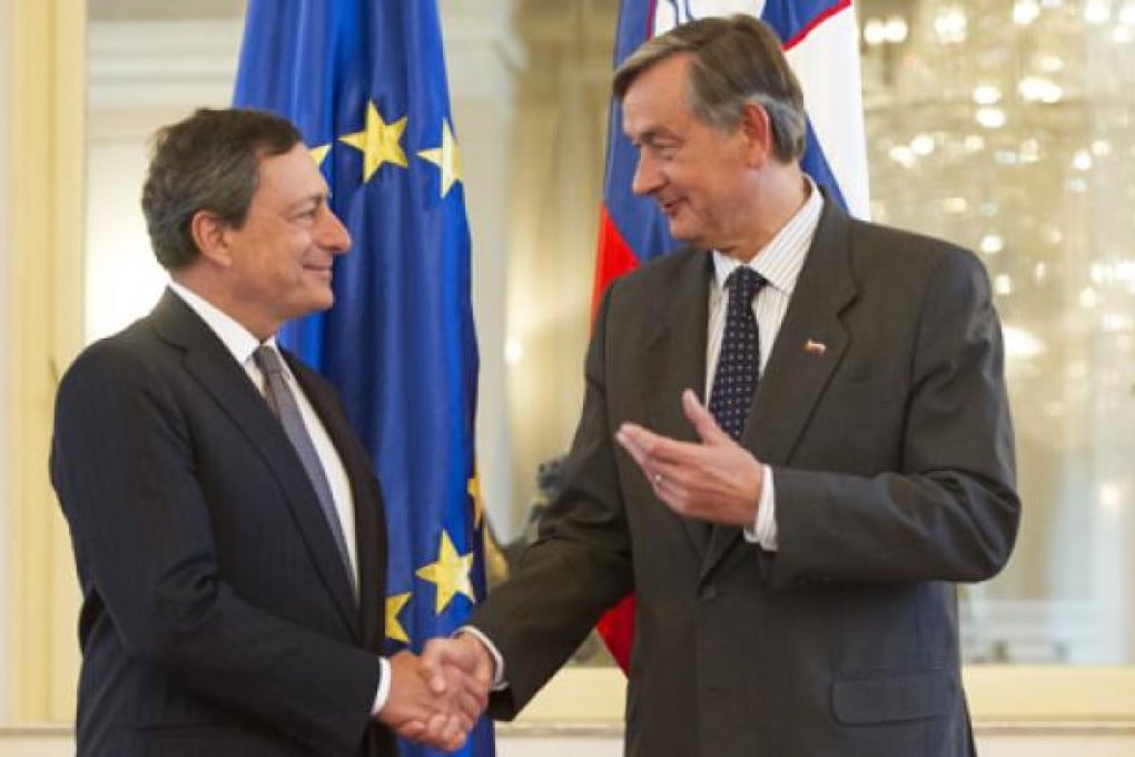 Slovenian President Danilo Turk (right) with ECB chief Mario Draghi in Ljubljana, Slovenia, on Wednesday. Photo: AFP