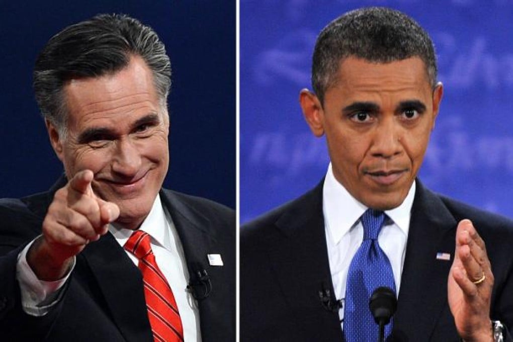 US President Barack Obama (R) speaks during his debate with Republican Presidential candidate Mitt Romney (L), who greets the audience at the conclusion in Denver, Colorado, on October 3, 2012. Photo: AFP