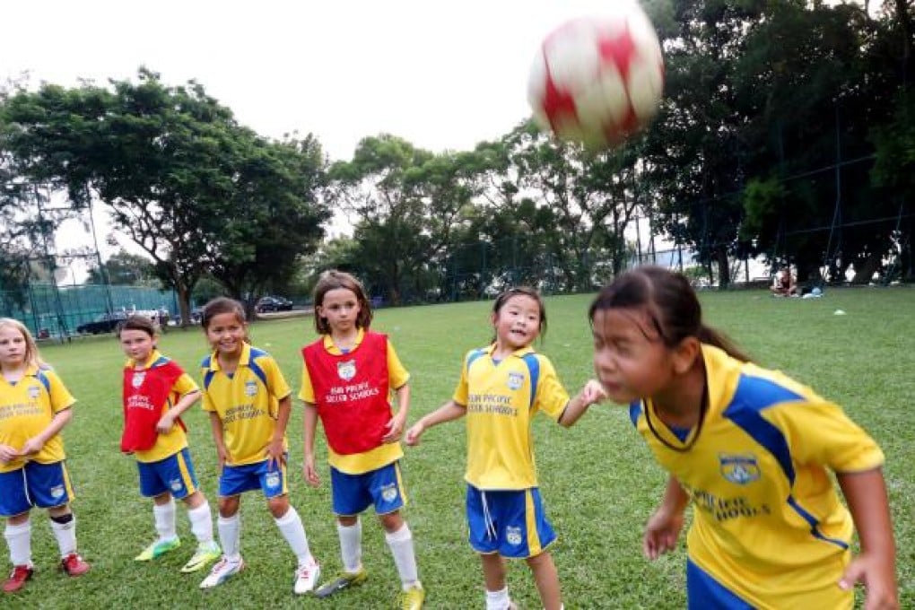 Girls in heading drills at the Stanley Ho Sports Centre. Girls' soccer is one of the fastest growing areas of the youth football scene worldwide. Photo: David Wong