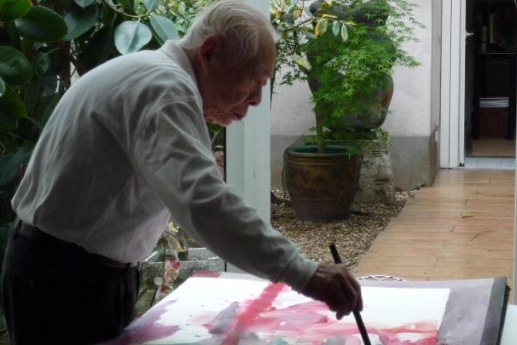 Zao Wou-ki at work on a watercolour before his health declined.