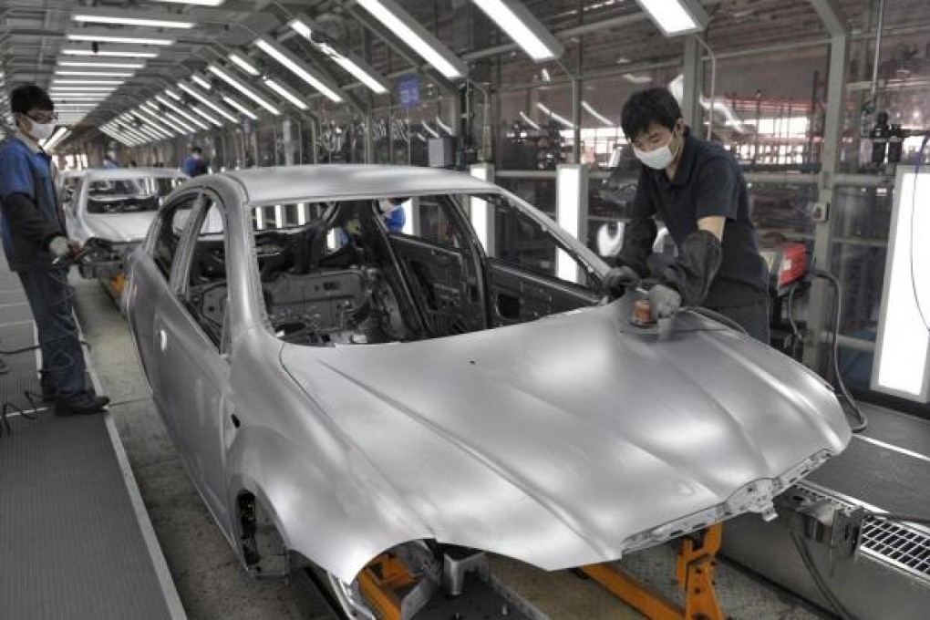 A production line at Brilliance China Automotive in Shenyang. Shares in the carmaker, which makes BMW cars, rose 5.9 per cent yesterday. Photo: EPA