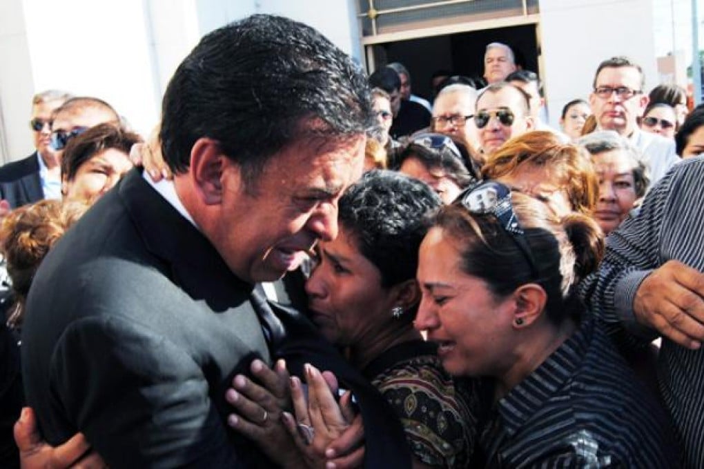 Former president of the Mexican Revolutionary Institutional Party (PRI) and former Governor of Coahuila state, Humberto Moreira (left) cries with relatives during the funeral of his son Jose Eduardo Moreira in Acuna, Mexico, on Thursday. Photo: EPA