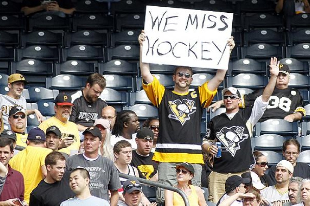 A hockey fan rues the delay to the NHL season at a match in Pittsburgh. Photo: AFP