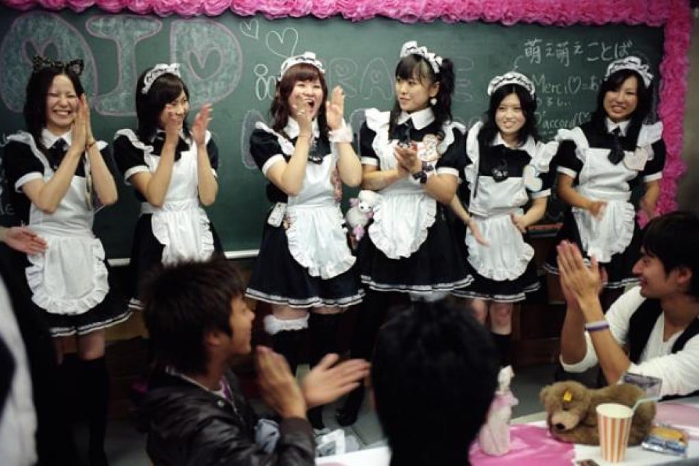 Waitresses in a French maid-themed cafe in the city. Photos: Marianne Lacey; Corbis