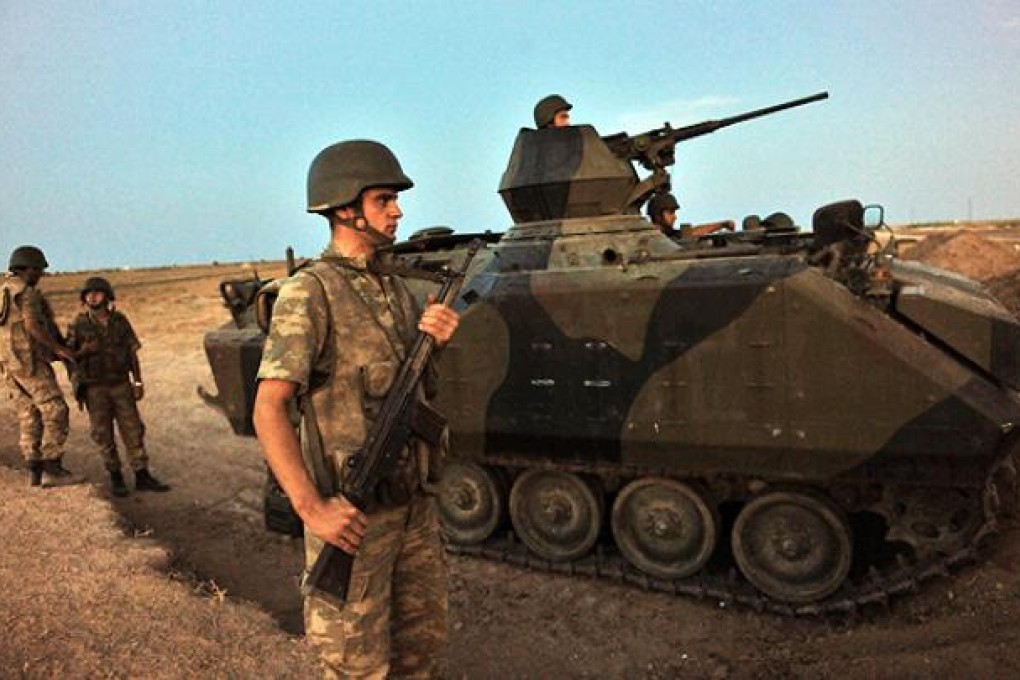 Turkish soldiers guard the Syrian border at Akcakale, Sanliurfa province. Photo: AFP