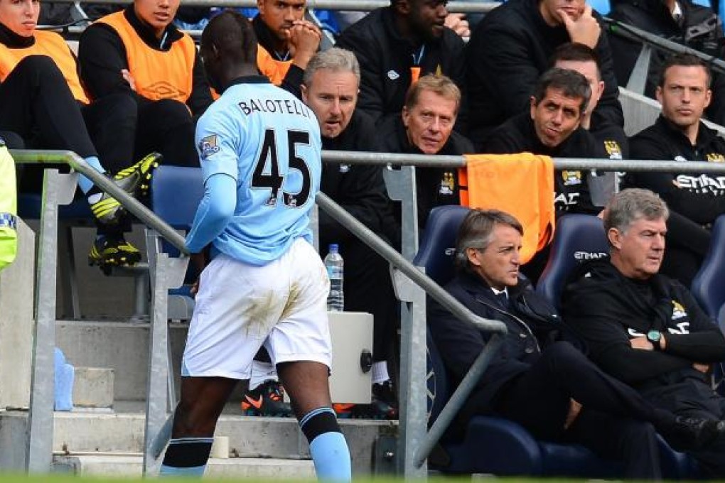 Mario Balotelli walks off after being substituted. Photo: AFP