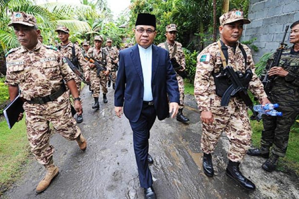 Moro Islamic Liberation Front (MILF) chairman Murad Ebrahim (centre) inside their base camp in Darapan, Sultan Kudarat province, in southern island of Mindanao last month. Photo: AFP