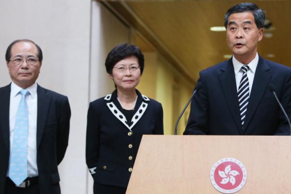 Leung Chun-ying (right) meets the media with Chief Secretary Carrie Lam and Secretary for Education Eddie Ng Hak-kim. Photo: Sam Tsang