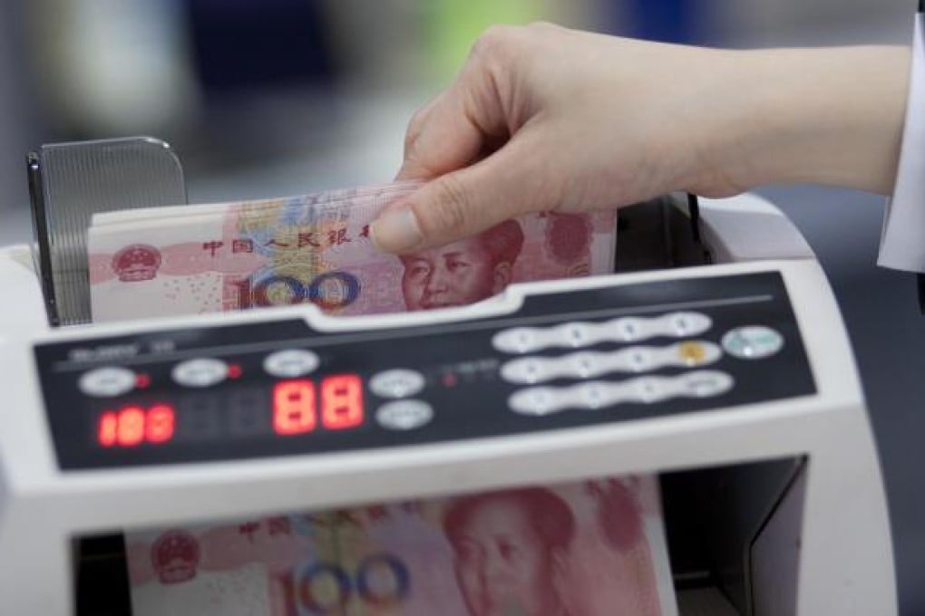 The yuan spiked against the US dollar in intraday trading, pushed up by quantitative easing in the US and expectations of policy measures from Beijing. Photo: Bloomberg